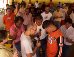Thomas Ben prays with prisoners in Maracaibo State Prison. Note the bulge in the man's shirt. He is one of the inmate gang leaders and had a gun in his pocket. He received Jesus that day!