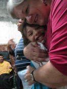 Sarita loves on a little girl in the children's home in Cabudare.