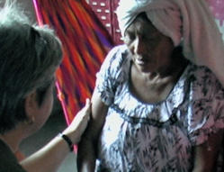 Sarita Rainey prays for a Wayuu woman who was sick.