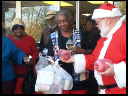 Santa hands out Christmas hams at Haven Chapel. (2015)