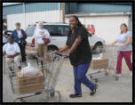 Volunteers brought the boxes out from the Bargain Center in the early years.