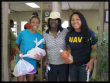 A client with volunteers from Hope Scholarship and the Navy.